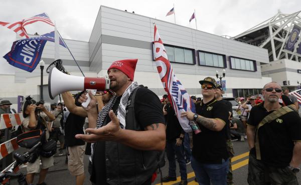 A group from the Proud Boys confronts anti-Trump protesters outside Trump's 2020 campaign kickoff rally Tuesday in Orlando, Fla. The Proud Boys group is known for white nationalist and other extremist rhetoric. A group from the Proud Boys confronts anti-Trump protesters outside Trump's 2020 campaign kickoff rally Tuesday in Orlando, Fla. The Proud Boys group is known for white nationalist and other extremist rhetoric.