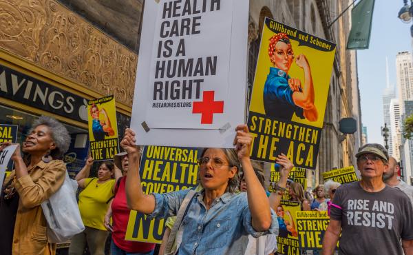Activists march to the offices of Sens. Chuck Schumer and Kirsten Gillibrand in New York City in September 2017, just before the start of Senate hearings on stabilizing the Affordable Care Act. Activists march to the offices of Sens. Chuck Schumer and Kirsten Gillibrand in New York City in September 2017, just before the start of Senate hearings on stabilizing the Affordable Care Act.