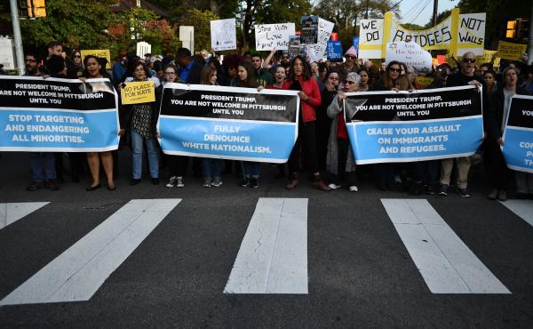 People protesting against President Trump gather near the Tree of Life Congregation, the site of a deadly shooting over the weekend, on Wednesday in Pittsburgh. People protesting against President Trump gather near the Tree of Life Congregation, the site of a deadly shooting over the weekend, on Wednesday in Pittsburgh.