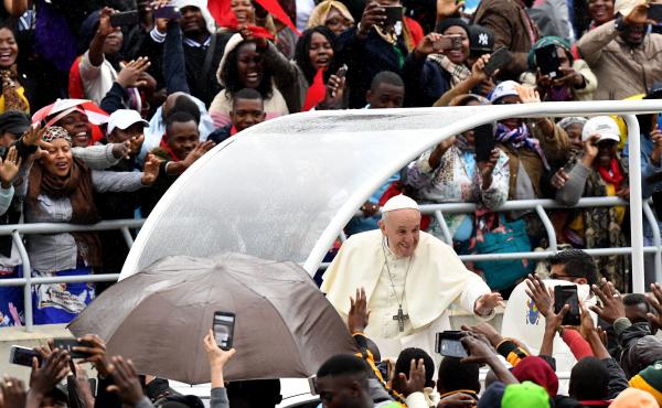 Pope Francis waves as he arrives at Zimpeto Stadium in Maputo, Mozambique, on Thursday, where he led a public Mass. Pope Francis waves as he arrives at Zimpeto Stadium in Maputo, Mozambique, on Thursday, where he led a public Mass.