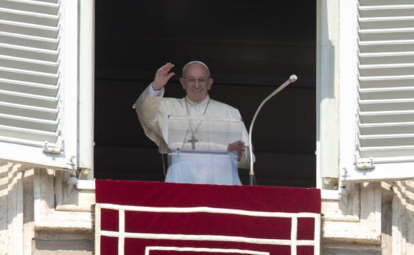 Pope Francis waves prior to reciting the Angelus noon prayer from the window of his studio overlooking St. Peter's Square, at the Vatican. Pope Francis waves prior to reciting the Angelus noon prayer from the window of his studio overlooking St. Peter's Square, at the Vatican.