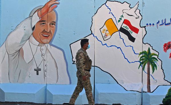 An Iraqi policeman walks by a mural depicting Pope Francis on the outer walls of Our Lady of Salvation Church in Baghdad on Monday. Pope Francis' visit from March 5 to 8 will include trips to Baghdad, the city of Mosul and a meeting with the country's top An Iraqi policeman walks by a mural depicting Pope Francis on the outer walls of Our Lady of Salvation Church in Baghdad on Monday. Pope Francis' visit from March 5 to 8 will include trips to Baghdad, the city of Mosul and a meeting with the country's top