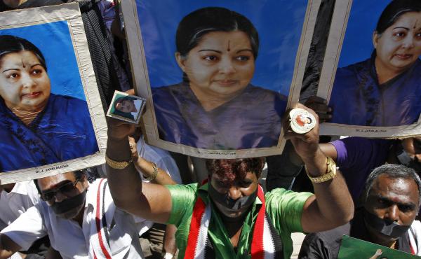 Supporters of J. Jayalalithaa, chief minister of India's Tamil Nadu state and head of the AIADMK party, hold a protest against a prison sentence for the popular politician in the southern Indian city of Chennai Sunday. Supporters of J. Jayalalithaa, chief minister of India's Tamil Nadu state and head of the AIADMK party, hold a protest against a prison sentence for the popular politician in the southern Indian city of Chennai Sunday.