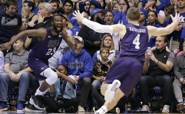 Stephen F. Austin forward Nathan Bain (23) and guard David Kachelries (4) celebrate Bain's game-winning shot against Duke in overtime Tuesday in Durham, N.C. Stephen F. Austin forward Nathan Bain (23) and guard David Kachelries (4) celebrate Bain's game-winning shot against Duke in overtime Tuesday in Durham, N.C.