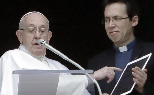 Pope Francis points at a tablet as he unveils Click To Pray, the official app of the Pope's Worldwide Prayer Network on Sunday. Pope Francis points at a tablet as he unveils Click To Pray, the official app of the Pope's Worldwide Prayer Network on Sunday.