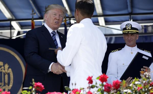 President Trump congratulates a U.S. Naval Academy midshipman Friday in Annapolis, Md. President Trump congratulates a U.S. Naval Academy midshipman Friday in Annapolis, Md.