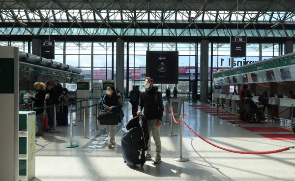 A passenger checks flight information at Fiumicino airport in Rome, Italy. President Trump imposed a 30-day ban on most travelers coming from from European countries, beginning late Friday E.T. A passenger checks flight information at Fiumicino airport in Rome, Italy. President Trump imposed a 30-day ban on most travelers coming from from European countries, beginning late Friday E.T.