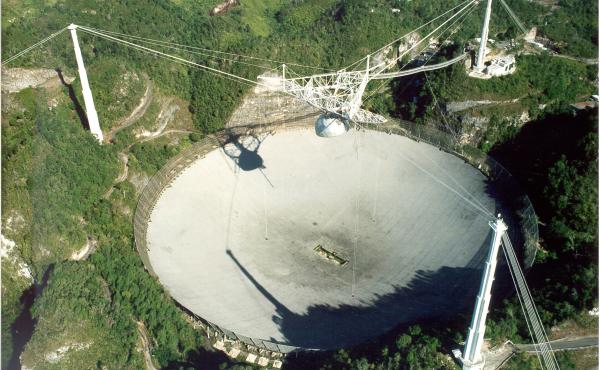 Until it was surpassed recently by a similar instrument in China, the Arecibo radio telescope in Puerto Rico, completed in 1963, was the world's single largest. Until it was surpassed recently by a similar instrument in China, the Arecibo radio telescope in Puerto Rico, completed in 1963, was the world's single largest.