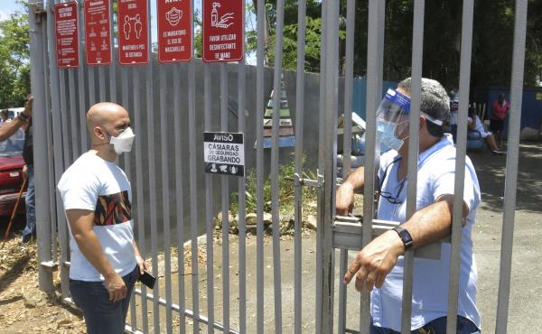 An electoral official (right) tells a voter that ballots haven't arrived at a voting center Sunday in Carolina, Puerto Rico. An electoral official (right) tells a voter that ballots haven't arrived at a voting center Sunday in Carolina, Puerto Rico.