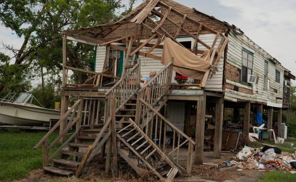 Annie Parfait, a Houma Nation elder, sits outside her home in Dulac, La., on Sept. 21, three weeks after Hurricane Ida made landfall in southeast Louisiana. Parfait, 70, rode out the storm at the Houma Nation Headquarters in Houma, La. Annie Parfait, a Houma Nation elder, sits outside her home in Dulac, La., on Sept. 21, three weeks after Hurricane Ida made landfall in southeast Louisiana. Parfait, 70, rode out the storm at the Houma Nation Headquarters in Houma, La.