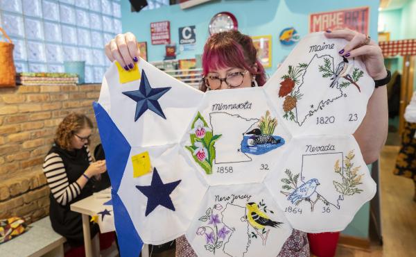 Jenni Grover holds a collection of finished patches from a quilt created by more than 100 volunteers across the country. The plans for the quilt were discovered at the estate sale of 99-year-old Rita Smith, who died earlier this year. Several dozen volunt Jenni Grover holds a collection of finished patches from a quilt created by more than 100 volunteers across the country. The plans for the quilt were discovered at the estate sale of 99-year-old Rita Smith, who died earlier this year. Several dozen volunt