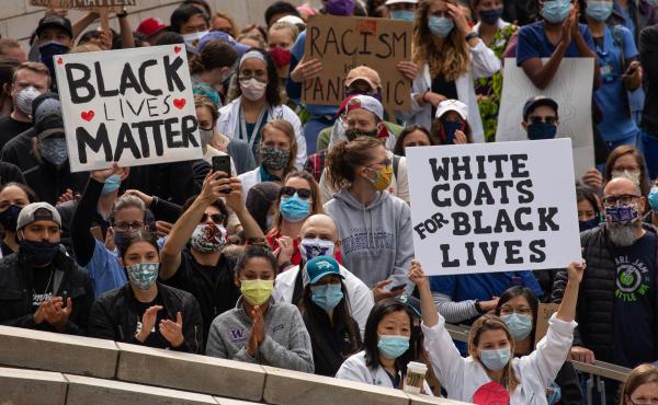 Health workers and others rallied in Seattle during a Doctors For Justice event on June 6, protesting police brutality in the wake of George Floyd's death. Medical training needs a hard look too, doctors say: Students of color and LGBTQ people often bear Health workers and others rallied in Seattle during a Doctors For Justice event on June 6, protesting police brutality in the wake of George Floyd's death. Medical training needs a hard look too, doctors say: Students of color and LGBTQ people often bear
