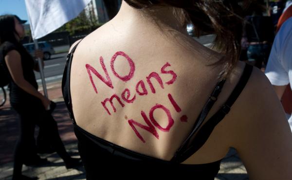 A woman's back sends a message at a protest march in Capetown in 2011. A woman's back sends a message at a protest march in Capetown in 2011.