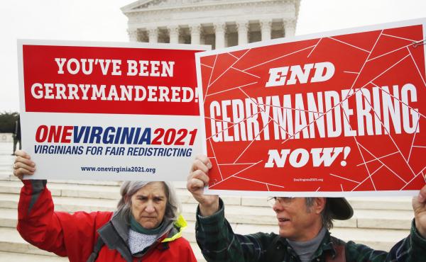 Sara Fitzgerald and Michael Martin, both with the group One Virginia, protest gerrymandering in front of the Supreme Court in March 2018. Sara Fitzgerald and Michael Martin, both with the group One Virginia, protest gerrymandering in front of the Supreme Court in March 2018.