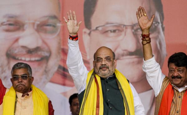 India Home Minister Amit Shah (center) introduced India's new citizenship law that fast-tracks naturalization for some non-Muslim migrants. Opponents say it violates India's secular constitution. India Home Minister Amit Shah (center) introduced India's new citizenship law that fast-tracks naturalization for some non-Muslim migrants. Opponents say it violates India's secular constitution.