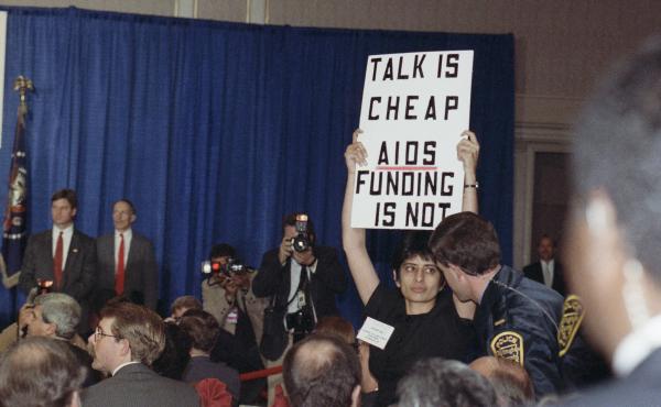 Urvashi Vaid, then-executive director of the National Gay and Lesbian Task Force, protests at then-President George H.W. Bush's address on AIDS in March 1990 in Arlington, Virginia. The pioneering LGBTQ activist and attorney died last week at age 63. Urvashi Vaid, then-executive director of the National Gay and Lesbian Task Force, protests at then-President George H.W. Bush's address on AIDS in March 1990 in Arlington, Virginia. The pioneering LGBTQ activist and attorney died last week at age 63.