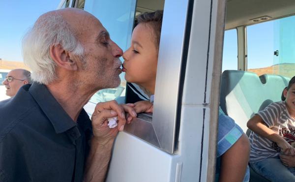 Grandfather Issam kisses his grandson Rayan goodbye before the 4-year-old left to enter Iraq. Issam did not have papers to cross. "Separation has killed the people. It's destroyed a generation. War is without a purpose," Issam said, crying. Grandfather Issam kisses his grandson Rayan goodbye before the 4-year-old left to enter Iraq. Issam did not have papers to cross. "Separation has killed the people. It's destroyed a generation. War is without a purpose," Issam said, crying.
