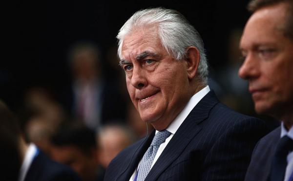 Rex Tillerson, chief executive officer of Exxon Mobile Corp., left, listens on the opening day of the St. Petersburg International Economic Forum this past June. Rex Tillerson, chief executive officer of Exxon Mobile Corp., left, listens on the opening day of the St. Petersburg International Economic Forum this past June.