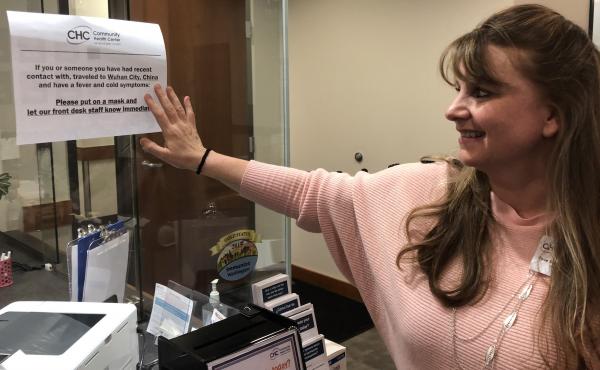 Tove Skaftun, the chief nursing officer for the Community Health Center of Snohomish County, points out a sign warning people who could have been exposed to the new coronavirus from China to identify themselves. Tove Skaftun, the chief nursing officer for the Community Health Center of Snohomish County, points out a sign warning people who could have been exposed to the new coronavirus from China to identify themselves.