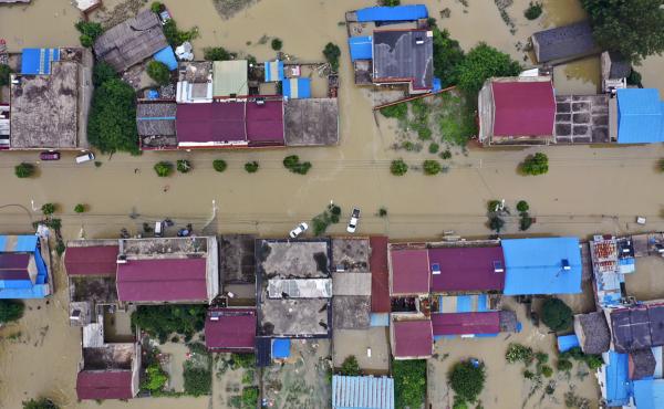 An aerial photo shows the extent of flooding in Guzhen Town of Lu'an City in eastern China's Anhui province on July 20. An aerial photo shows the extent of flooding in Guzhen Town of Lu'an City in eastern China's Anhui province on July 20.