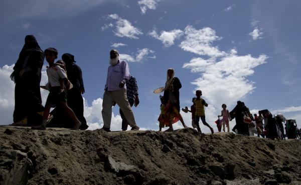 Newly arrived Rohingya Muslims from Myanmar walk to a camp for refugees in Teknaf, Bangladesh, on Monday. Hundreds of thousands of Rohingya refugees have streamed across the border following Myanmarese military retaliation for attacks by a Rohingya milita Newly arrived Rohingya Muslims from Myanmar walk to a camp for refugees in Teknaf, Bangladesh, on Monday. Hundreds of thousands of Rohingya refugees have streamed across the border following Myanmarese military retaliation for attacks by a Rohingya milita
