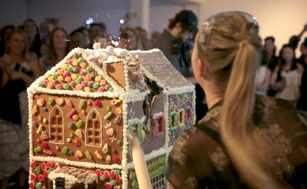 The Gingerbread Demolition lets people destroy gingerbread houses for charity. The Gingerbread Demolition lets people destroy gingerbread houses for charity.