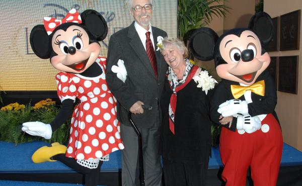 Russi Taylor and her husband Bruce Allwine pose with their characters Minnie and Mickey Mouse at the 2008 Disney Legends Ceremony at the Walt Disney Studios in Burbank, California. Russi Taylor and her husband Bruce Allwine pose with their characters Minnie and Mickey Mouse at the 2008 Disney Legends Ceremony at the Walt Disney Studios in Burbank, California.