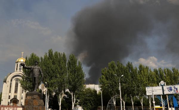 Smoke rises from a burning house following shelling in Donetsk, eastern Ukraine, on Friday. Smoke rises from a burning house following shelling in Donetsk, eastern Ukraine, on Friday.