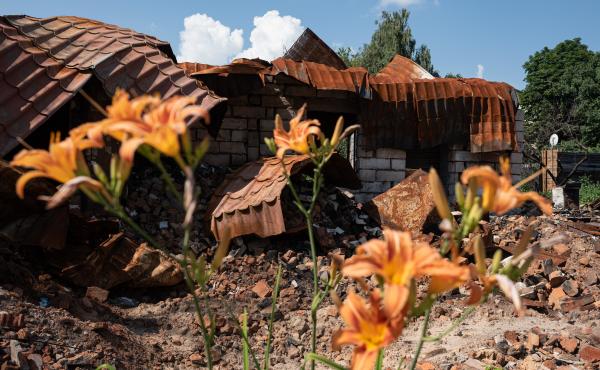 A destroyed building next to flowers on Thursday in Borodianka, Ukraine. The region around Ukraine's capital continues to recover from Russia's aborted assault on Kyiv, which turned many communities into battlefields. A destroyed building next to flowers on Thursday in Borodianka, Ukraine. The region around Ukraine's capital continues to recover from Russia's aborted assault on Kyiv, which turned many communities into battlefields.
