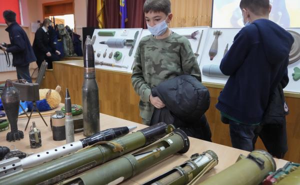 Schoolchildren look at explosives during a police-organized civilian safety lesson in a city school in Kyiv, Ukraine, on Thursday. City authorities have launched training for civilians amid fears about a Russian invasion. Schoolchildren look at explosives during a police-organized civilian safety lesson in a city school in Kyiv, Ukraine, on Thursday. City authorities have launched training for civilians amid fears about a Russian invasion.