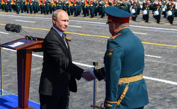 Russian President Vladimir Putin and Defense Minister Sergei Shoigu shake hands at this month's Victory Day military parade marking the 75th anniversary of Nazi Germany's defeat in World War II. Russian President Vladimir Putin and Defense Minister Sergei Shoigu shake hands at this month's Victory Day military parade marking the 75th anniversary of Nazi Germany's defeat in World War II.