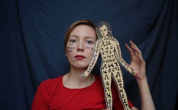 A self-portrait of Darya Apakhonchich, with the writing on her face and a figure of a woman saying: "Not only a body but a person, person, person, person, person." She made the photo in support of Russian artist and LGBTQ activist Yulia Tsvetkova, who fac A self-portrait of Darya Apakhonchich, with the writing on her face and a figure of a woman saying: "Not only a body but a person, person, person, person, person." She made the photo in support of Russian artist and LGBTQ activist Yulia Tsvetkova, who fac