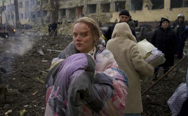 Mariana Vishegirskaya stands outside a maternity hospital that was damaged by shelling in Mariupol, Ukraine, on March 9. Vishegirskaya later gave birth to a girl in another hospital in Mariupol. Mariana Vishegirskaya stands outside a maternity hospital that was damaged by shelling in Mariupol, Ukraine, on March 9. Vishegirskaya later gave birth to a girl in another hospital in Mariupol.