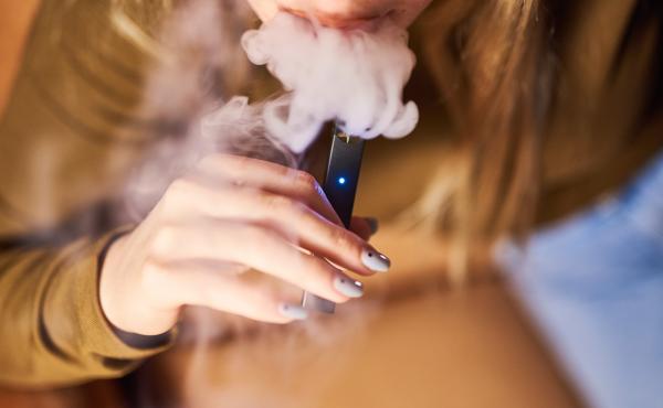 A person smokes a Juul Labs Inc. e-cigarette in a photograph taken in New York, last year. A person smokes a Juul Labs Inc. e-cigarette in a photograph taken in New York, last year.