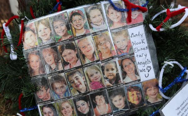 Photos of Sandy Hook Elementary School massacre victims sits at a small memorial near the school on Jan. 14, 2013 in Newtown, Conn. Photos of Sandy Hook Elementary School massacre victims sits at a small memorial near the school on Jan. 14, 2013 in Newtown, Conn.