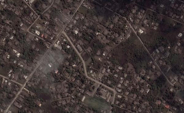 This satellite image provided shows ash covered homes and buildings in Tonga Tuesday, Jan. 18, 2022 days after a huge undersea volcanic eruption. This satellite image provided shows ash covered homes and buildings in Tonga Tuesday, Jan. 18, 2022 days after a huge undersea volcanic eruption.