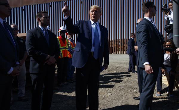 President Trump talks with reporters after touring a section of the southern border wall in September in Otay Mesa, Calif. President Trump talks with reporters after touring a section of the southern border wall in September in Otay Mesa, Calif.