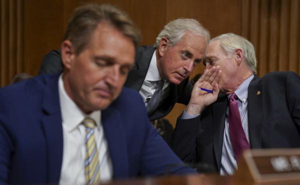 Sens. Jeff Flake, R-Ariz., Bob Corker, R-Tenn., and Ron Johnson, R-Wis., seen at a hearing earlier this month, held up floor action on Thursday evening over concerns about how to control the deficit if the GOP tax bill doesn't result in strong economic gr Sens. Jeff Flake, R-Ariz., Bob Corker, R-Tenn., and Ron Johnson, R-Wis., seen at a hearing earlier this month, held up floor action on Thursday evening over concerns about how to control the deficit if the GOP tax bill doesn't result in strong economic gr