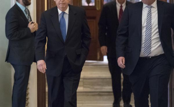 Senate Majority Leader Mitch McConnell, R-Ky., walks from the chamber to his office during a long series of votes at the Capitol on Thursday. Senate Majority Leader Mitch McConnell, R-Ky., walks from the chamber to his office during a long series of votes at the Capitol on Thursday.