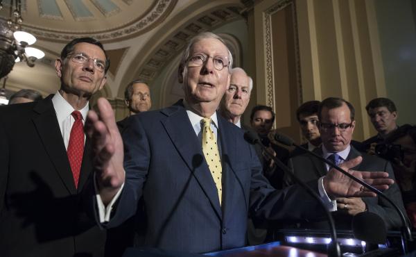 Senate Majority Leader Mitch McConnell, joined by other Republican senators, meets with reporters following a closed-door strategy session at the Capitol on Tuesday. Senate Majority Leader Mitch McConnell, joined by other Republican senators, meets with reporters following a closed-door strategy session at the Capitol on Tuesday.