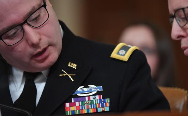 National Security Council Europe expert Lt. Col. Alexander Vindman (left) appears before the House Intelligence Committee during an impeachment hearing in November. National Security Council Europe expert Lt. Col. Alexander Vindman (left) appears before the House Intelligence Committee during an impeachment hearing in November.