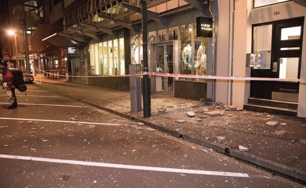 Debris from fallen concrete off buildings lies on the sidewalk in Wellington, after a powerful earthquake rocked New Zealand. The U.S. Geological Survey reports the quake had a 7.8 magnitude. Debris from fallen concrete off buildings lies on the sidewalk in Wellington, after a powerful earthquake rocked New Zealand. The U.S. Geological Survey reports the quake had a 7.8 magnitude.