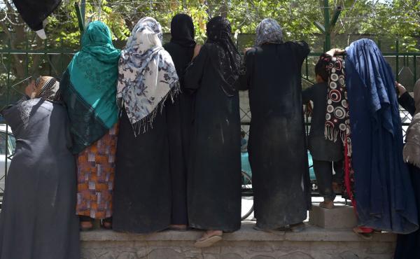 Internally displaced Afghan women, who fled because of battling between the Taliban and Afghan security forces, gather at Shahr-e-Naw Park in Kabul on Aug. 13. Internally displaced Afghan women, who fled because of battling between the Taliban and Afghan security forces, gather at Shahr-e-Naw Park in Kabul on Aug. 13.