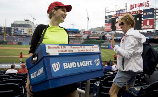 Nationals Park beer seller Christy Colt talks to a customer in the stands before a recent Nationals game. Nationals Park beer seller Christy Colt talks to a customer in the stands before a recent Nationals game.