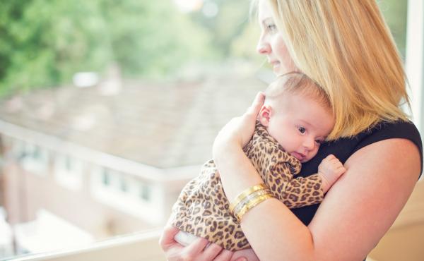 Lisa Abramson holds her firstborn child, Lucy, in 2014. A few weeks after Lucy's birth, Abramson began feeling confused and then started developing delusions — symptoms of postpartum psychosis. Lisa Abramson holds her firstborn child, Lucy, in 2014. A few weeks after Lucy's birth, Abramson began feeling confused and then started developing delusions — symptoms of postpartum psychosis.