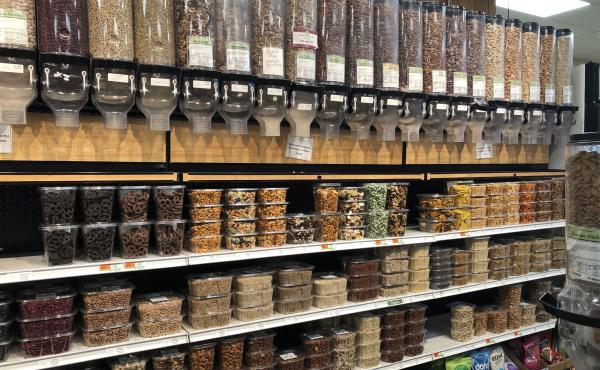 Nuts and dried fruit items at a grocery store. Nuts and dried fruit items at a grocery store.