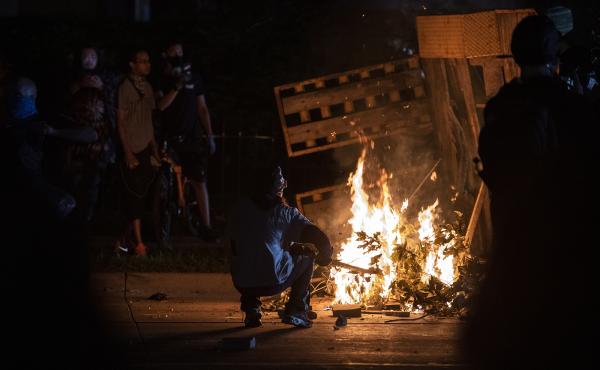 A protester in Kenosha lights some debris on fire on Aug. 26, 2020. A protester in Kenosha lights some debris on fire on Aug. 26, 2020.