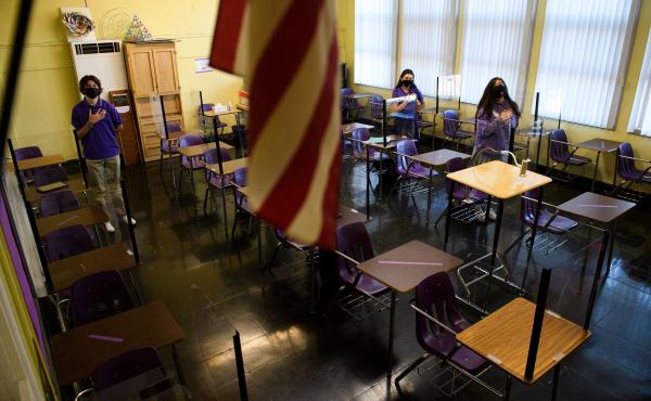 Students stand for the Pledge of Allegiance as they return to in-person learning at St. Anthony Catholic High School in California on March 24. Masks and physical distancing are proving to have some major public health benefits, keeping people from gettin Students stand for the Pledge of Allegiance as they return to in-person learning at St. Anthony Catholic High School in California on March 24. Masks and physical distancing are proving to have some major public health benefits, keeping people from gettin