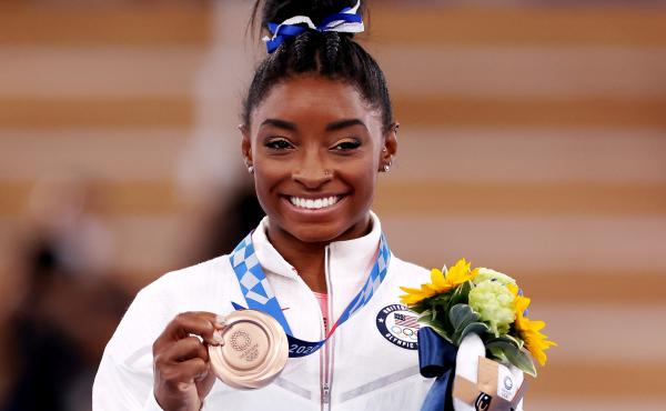 Simone Biles poses with the bronze medal during the Women's Balance Beam Final medal ceremony on day eleven of the Tokyo 2020 Olympic Games on August 03, 2021. Simone Biles poses with the bronze medal during the Women's Balance Beam Final medal ceremony on day eleven of the Tokyo 2020 Olympic Games on August 03, 2021.