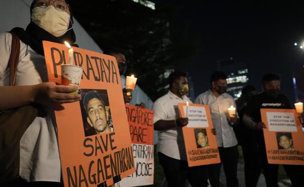 Activists holds posters against the impending execution of Nagaenthran K. Dharmalingam, sentenced to death for trafficking heroin into Singapore, during a candlelight vigil gathering outside the Singaporean Embassy in Kuala Lumpur, Malaysia, Tuesday, Apri Activists holds posters against the impending execution of Nagaenthran K. Dharmalingam, sentenced to death for trafficking heroin into Singapore, during a candlelight vigil gathering outside the Singaporean Embassy in Kuala Lumpur, Malaysia, Tuesday, Apri
